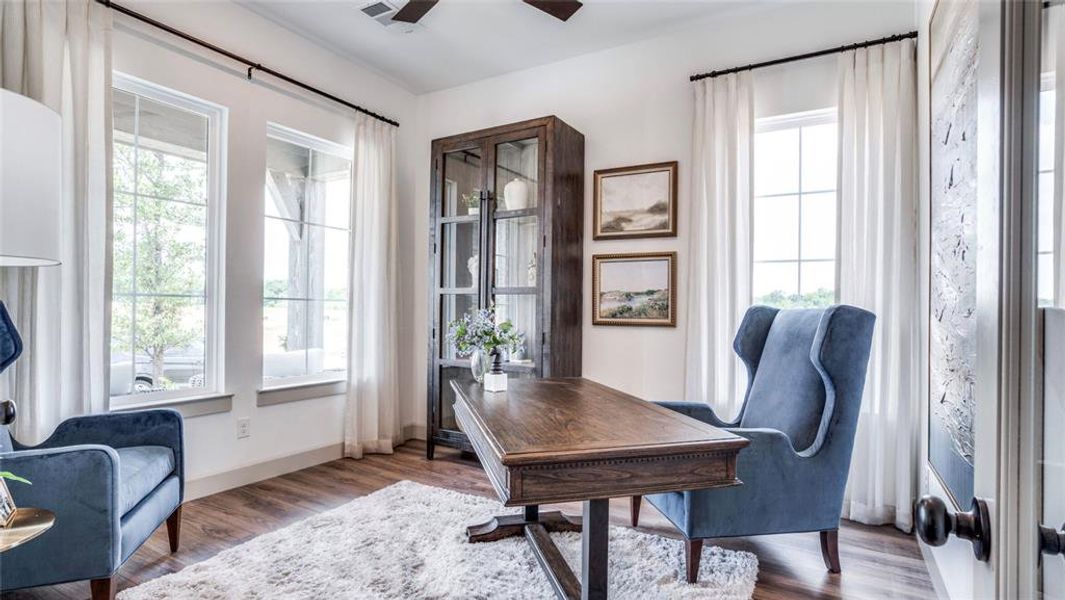 The front flex space is flooded with natural light and would make a perfect home office for the professional needing to work from home.