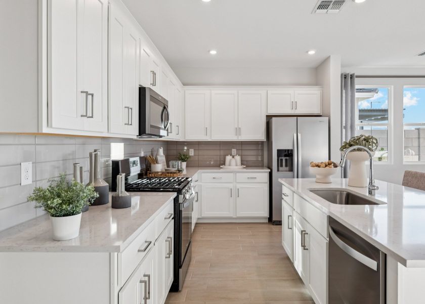 A kitchen with white cabinets. A kitchen with white cabinets.