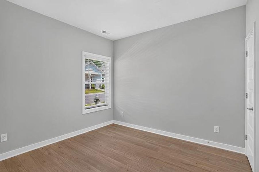 Spacious, unfurnished interior of a new home in The Cottages at East Lanier, Fayetteville (Image 10).