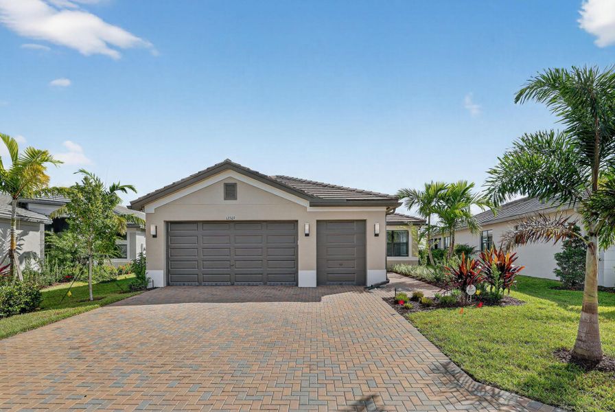 Front exterior of a new home in , Port St. Lucie, FL, highlighting curb appeal (Image 2).