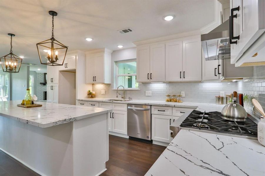 Versatile Style With Vintage Appeal. Gorgeous custom island kitchen with stunning Quartz countertops, upscale fixtures and stainless steel appliances.