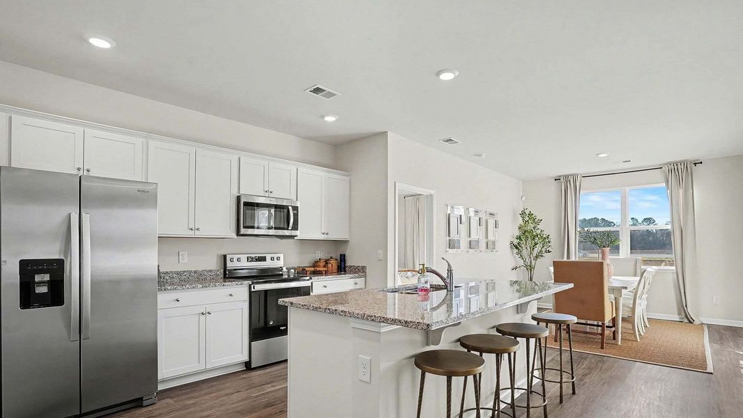 Representative furnished interior of a home built from the Aria by D.R. Horton in Meadow Walk, Loris (Image 7).