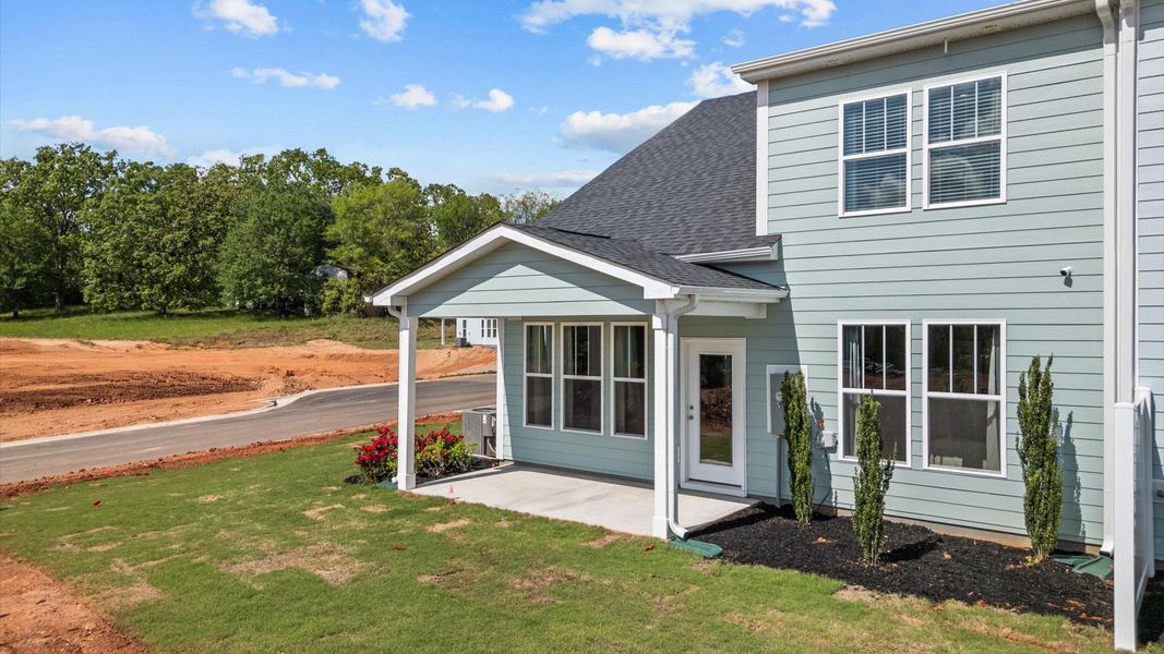Exterior details and patio area of a home in Village at Midway, Anderson (Image 4).