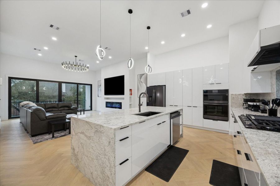 Open-concept kitchen with a natural flow into the living and dining areas, perfect for hosting, gathering, and everyday comfort.