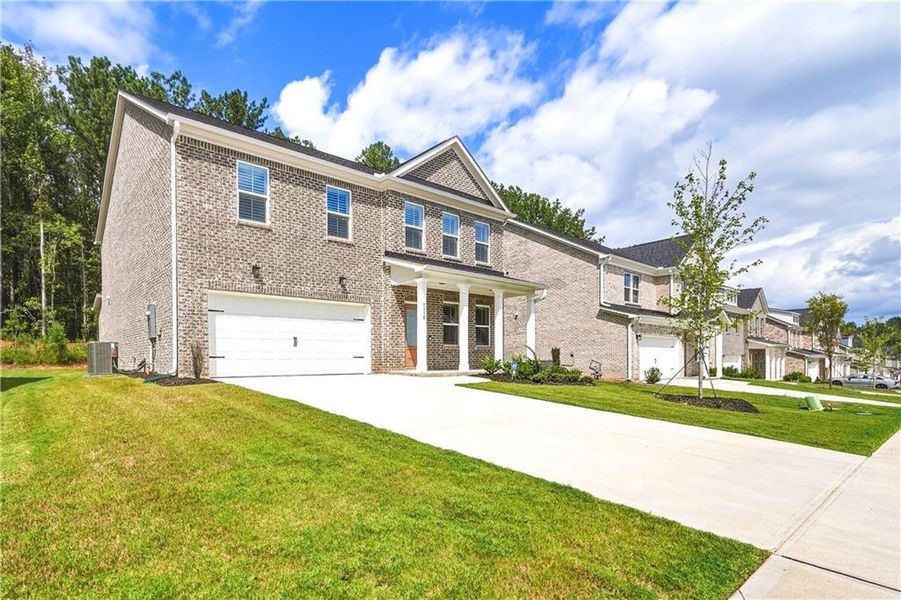 Front exterior of a new home in , Atlanta, GA, highlighting curb appeal (Image 25).