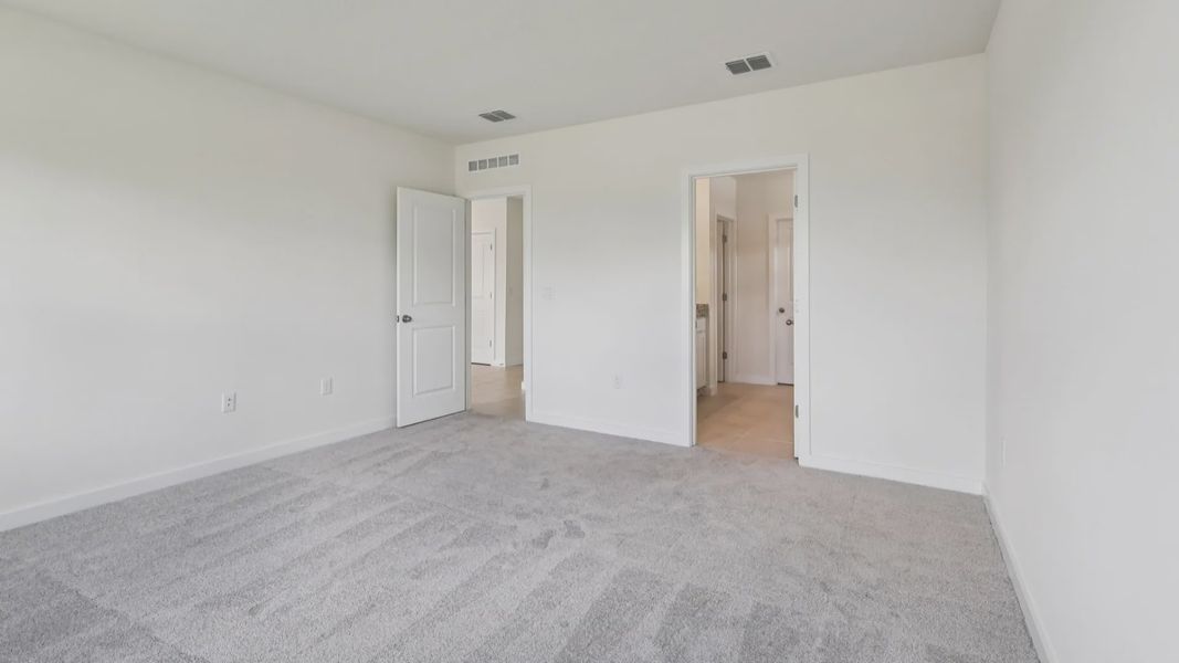 Primary Suite in the Baker Floor Plan by DRB Homes in Liberty Trace New Homes in Haines City