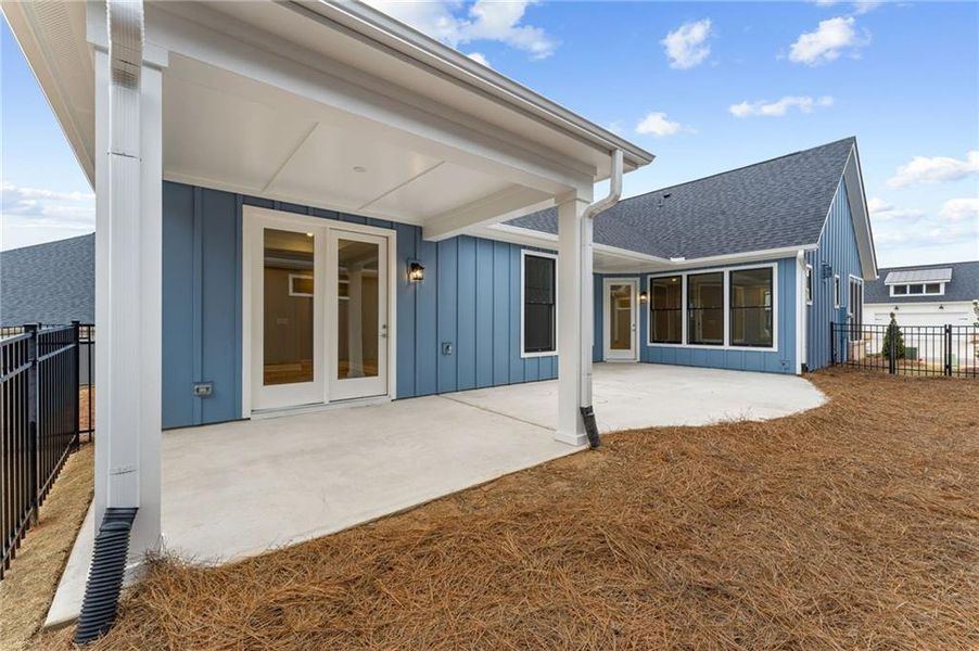 Exterior details and patio area of a home in The Courtyards at Redbud Lane, Holly Springs (Image 3).