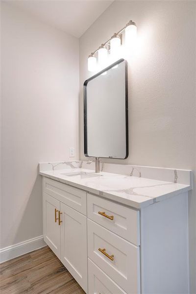 Bathroom featuring vanity and hardwood / wood-style flooring