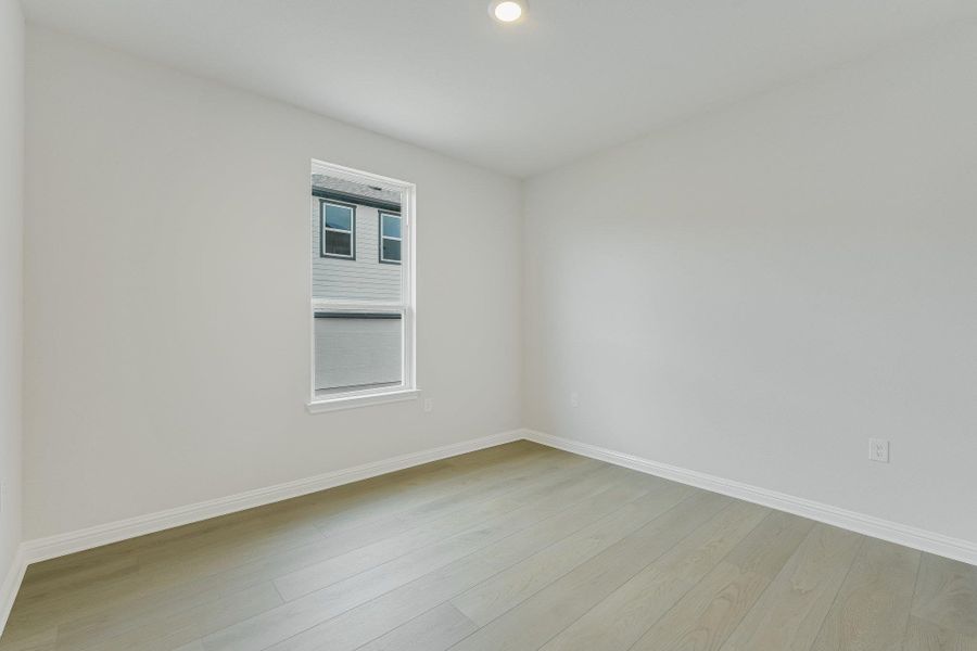 Spare room featuring light wood-type flooring and recessed lighting
