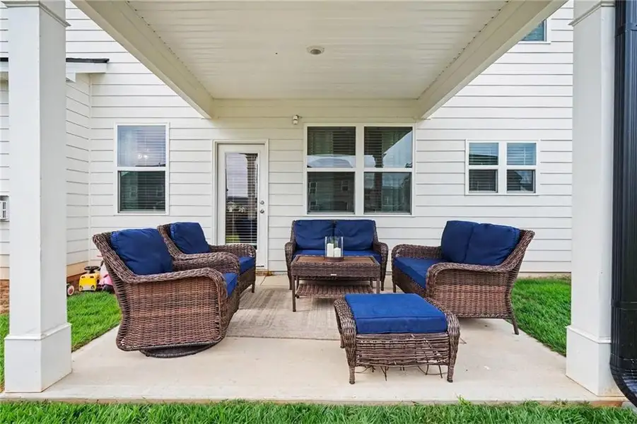 Exterior details and patio area of a home in Preserve at Dove Creek, Statham (Image 4).