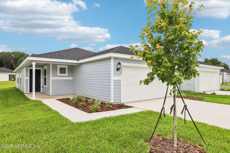 Front exterior of a new home in Kings Crossing, Jacksonville, FL, highlighting curb appeal (Image 19). Front exterior of a new home in Kings Crossing, Jacksonville, FL, highlighting curb appeal (Image 19).