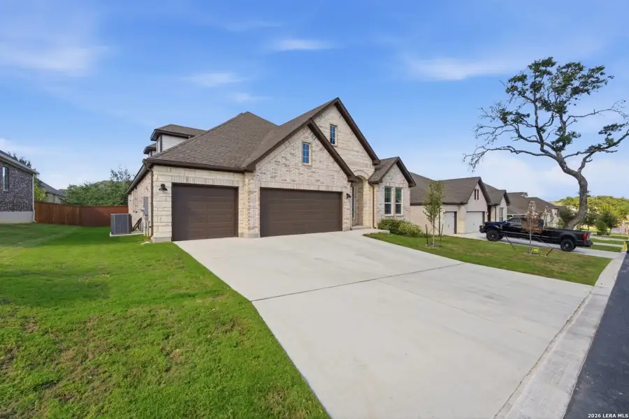 Front exterior of a new home in Front Gate at Fair Oaks Ranch 70, Fair Oaks Ranch, TX, highlighting curb appeal (Image 25). Front exterior of a new home in Front Gate at Fair Oaks Ranch 70, Fair Oaks Ranch, TX, highlighting curb appeal (Image 25).