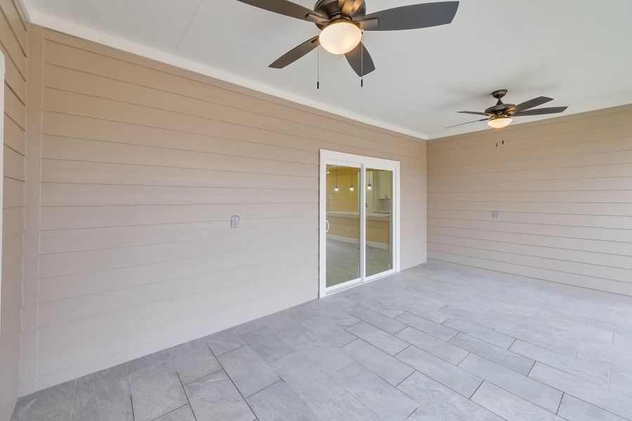 Covered patio deck providing a comfortable outdoor space for relaxing, dining, or entertaining in all weather conditions.