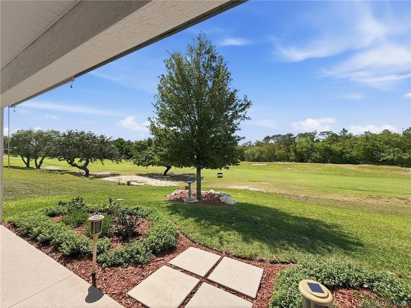 Exterior details and patio area of a home in The Fairways At Twisted Oaks, Beverly Hills (Image 35).