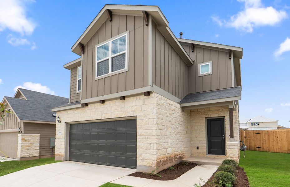 Front exterior of a new home in Sunfield, Buda, TX, highlighting curb appeal (Image 18).