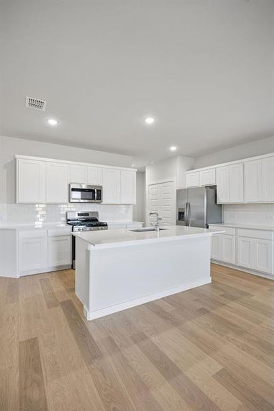 Kitchen in the Oak II home plan by Trophy Signature Homes – REPRESENTATIVE PHOTO