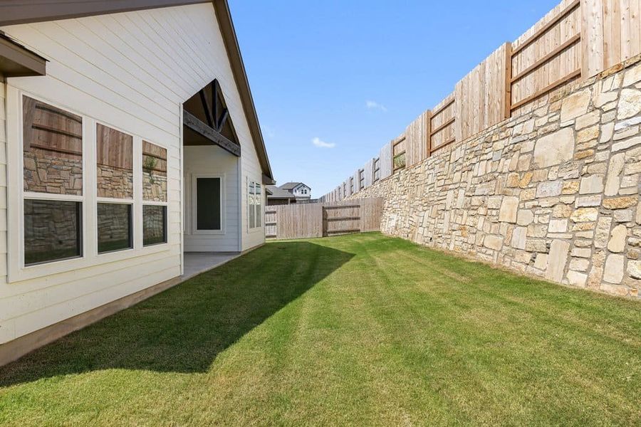 Exterior details and patio area of a home in Lariat, Liberty Hill (Image 23). Exterior details and patio area of a home in Lariat, Liberty Hill (Image 23).