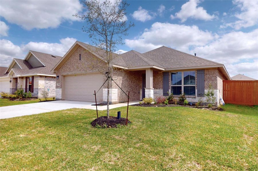 Front exterior of a new home in Cypress Green, Hockley, TX, highlighting curb appeal (Image 2). Front exterior of a new home in Cypress Green, Hockley, TX, highlighting curb appeal (Image 2).