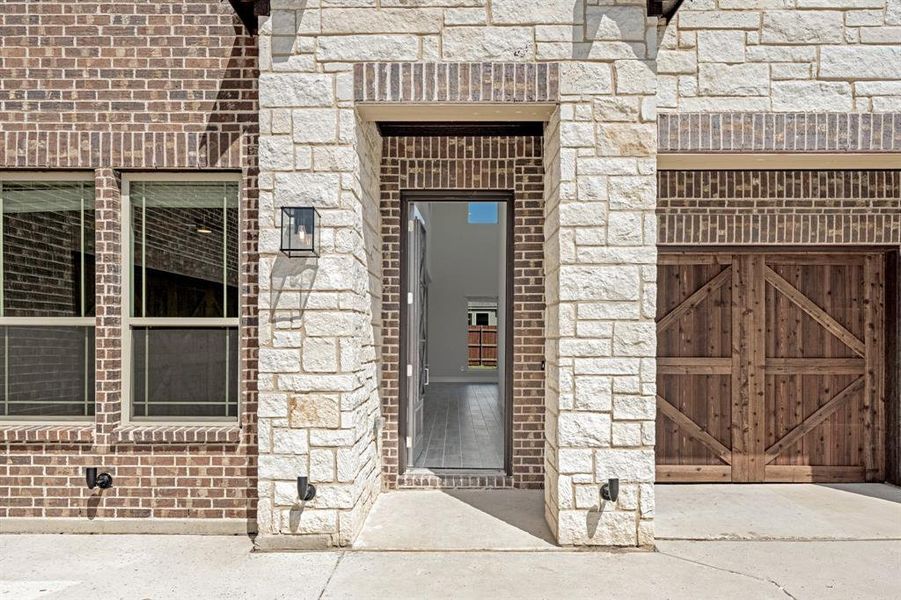 Front exterior of a new home in The Oasis at North Grove 75-80, Waxahachie, TX, highlighting curb appeal (Image 2). Front exterior of a new home in The Oasis at North Grove 75-80, Waxahachie, TX, highlighting curb appeal (Image 2).