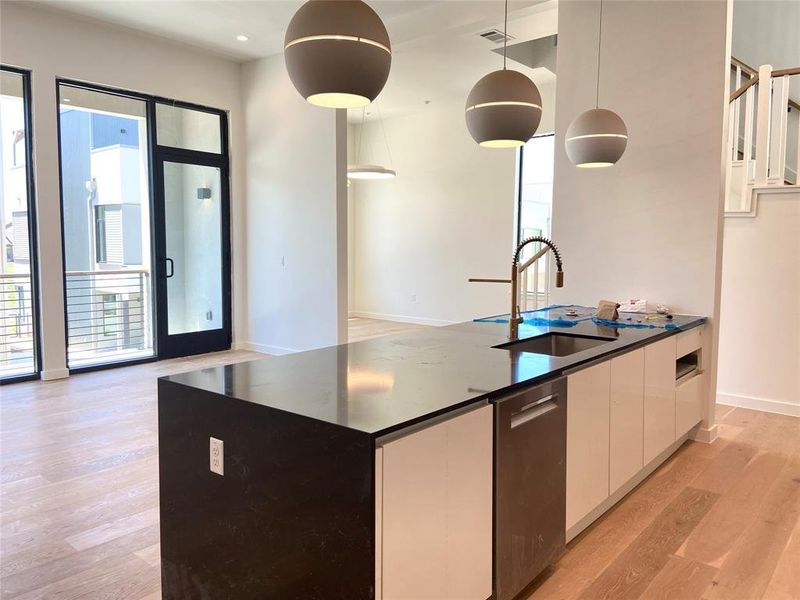 Waterfall quartz countertop. Large kitchen, living, and dining room is perfect for entertaining. Waterfall quartz countertop. Large kitchen, living, and dining room is perfect for entertaining.