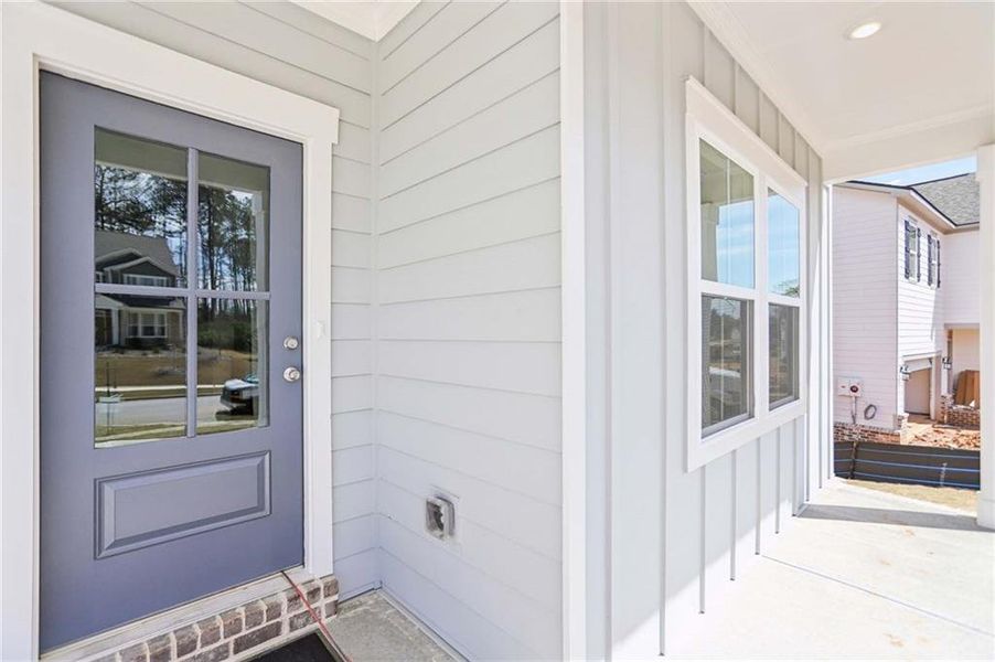 Exterior details and patio area of a home in The Pointe at Heron Bay, Locust Grove (Image 3).