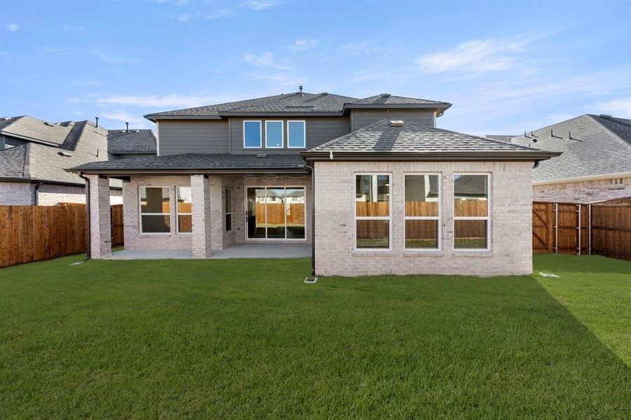 Exterior details and patio area of a home in Valencia on The Lake, Little Elm (Image 3).