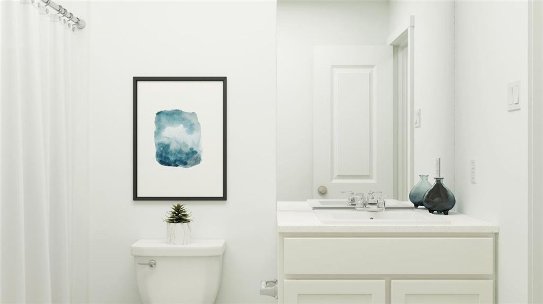 Bathroom with vanity and toilet