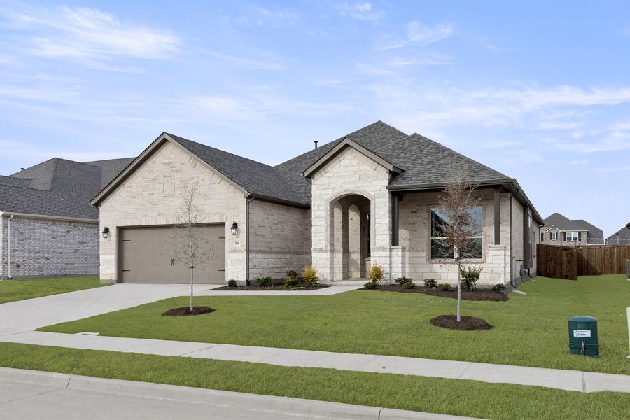 Front exterior of a new home in Anna Town Square, Anna, TX, highlighting curb appeal (Image 2). Front exterior of a new home in Anna Town Square, Anna, TX, highlighting curb appeal (Image 2).