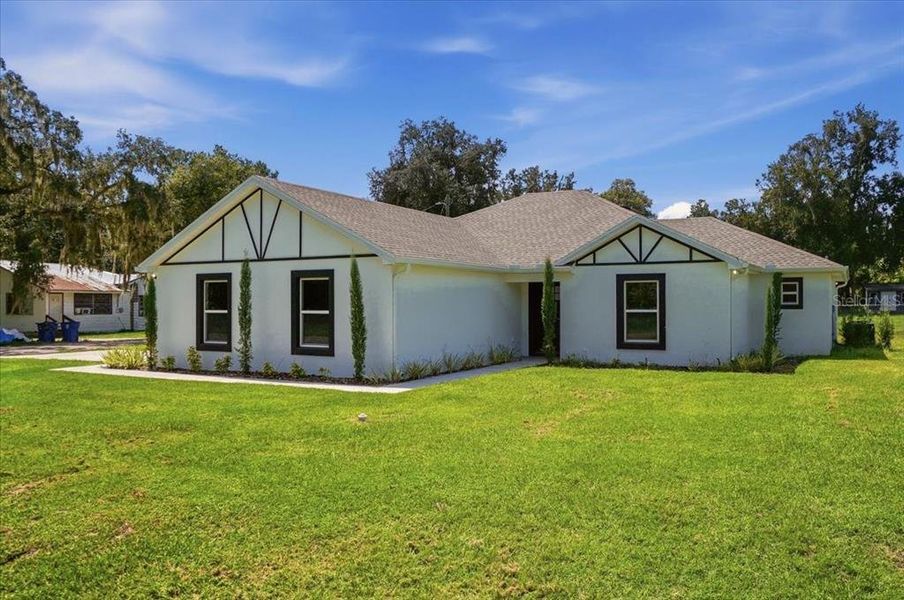 Front exterior of a new home in , Fort Meade, FL, highlighting curb appeal (Image 14). Front exterior of a new home in , Fort Meade, FL, highlighting curb appeal (Image 14).
