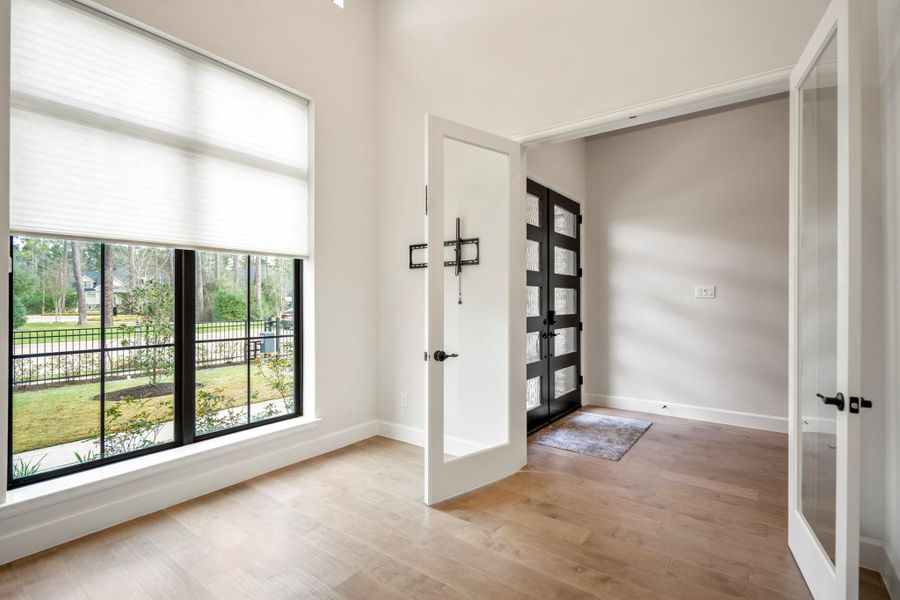 Light and bright dedicated study with double french glass doors.
