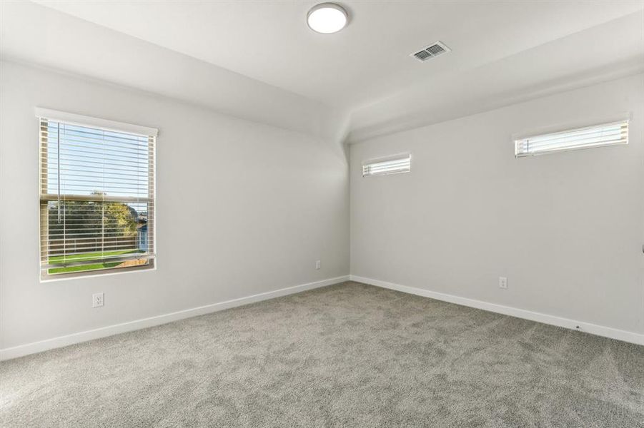 Bedroom in the Wimbledon home plan by Trophy Signature Homes – REPRESENTATIVE PHOTO