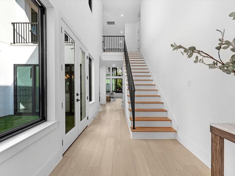 As you continue inside, French doors open to your private, fully turfed courtyard, an urban oasis ideal for peaceful mornings or cozy evenings with loved ones.