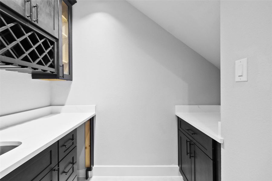 Just off the kitchen, your built-in bar with wine storage makes hosting feel seamless—you’re always ready to pour a glass and enjoy. Just off the kitchen, your built-in bar with wine storage makes hosting feel seamless—you’re always ready to pour a glass and enjoy.