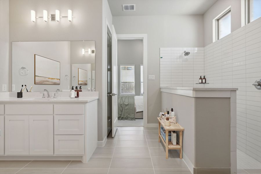 Primary Bathroom in the Picasso II home plan by Trophy Signature Homes – REPRESENTATIVE PHOTO