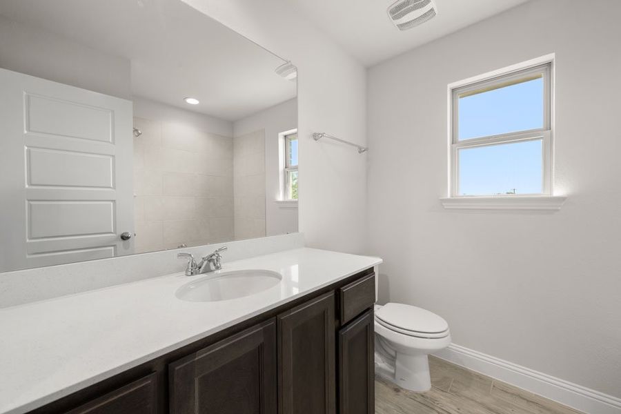 Front exterior of a new home in Still Water Lake, Godley, TX, highlighting curb appeal (Image 28). Front exterior of a new home in Still Water Lake, Godley, TX, highlighting curb appeal (Image 28).