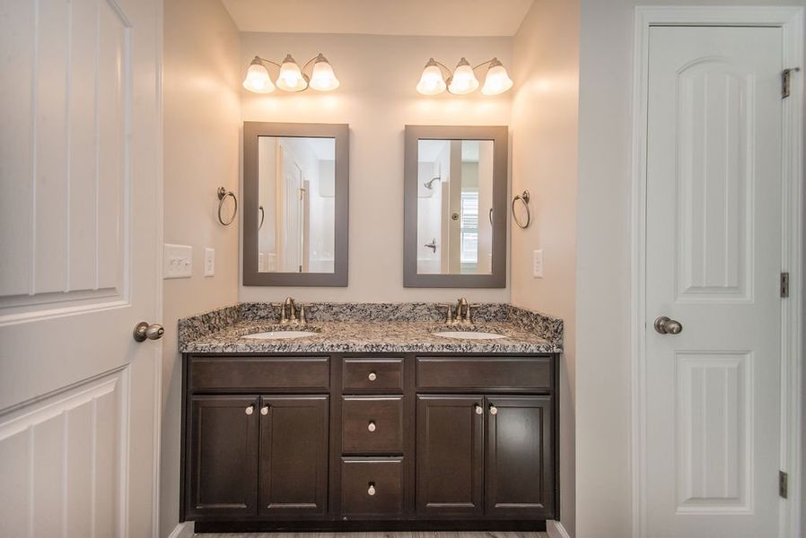 Representative furnished interior of a home built from the Quincy by Enchanted Homes in Hampshire Heights, Moore (Image 17).