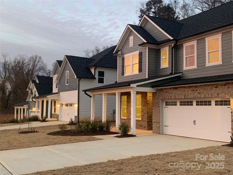 Front exterior of a new home in Enclave at Belmont, Belmont, NC, highlighting curb appeal (Image 15). Front exterior of a new home in Enclave at Belmont, Belmont, NC, highlighting curb appeal (Image 15).