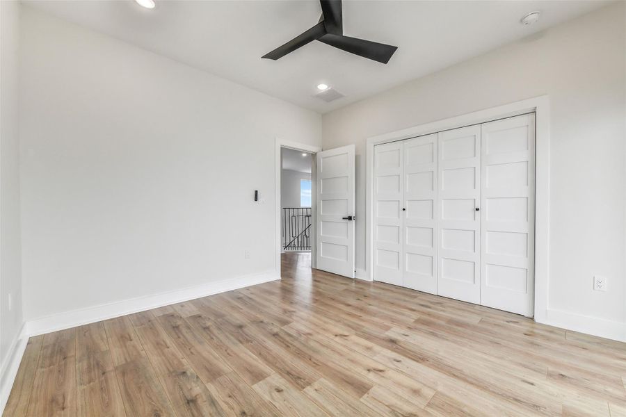 Wake up to sweeping bay views and step directly onto your private balcony to feel the coastal breeze. This never-lived-in bedroom blends high ceilings, tile flooring, and waterfront serenity into a daily luxury.