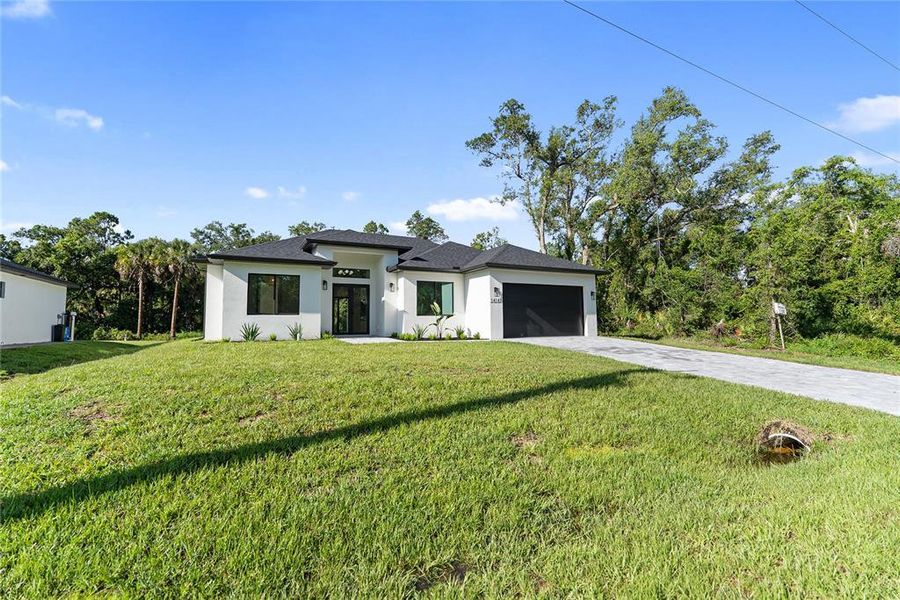 Front exterior of a new home in , Port Charlotte, FL, highlighting curb appeal (Image 30). Front exterior of a new home in , Port Charlotte, FL, highlighting curb appeal (Image 30).