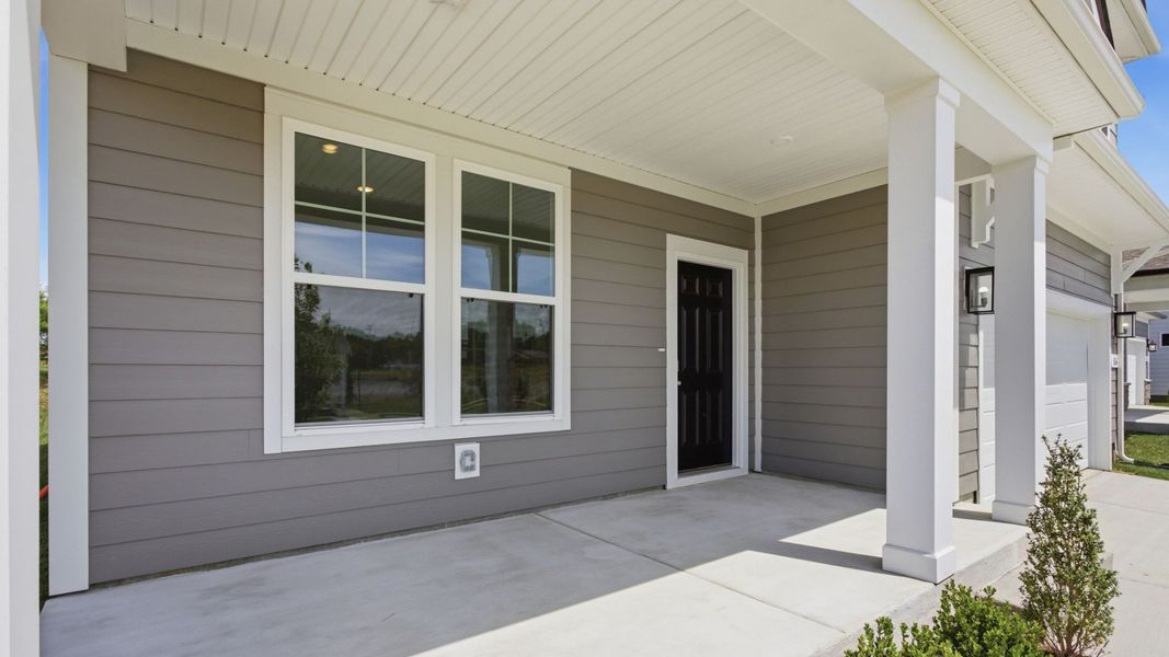Exterior entryway with black door Exterior entryway with black door