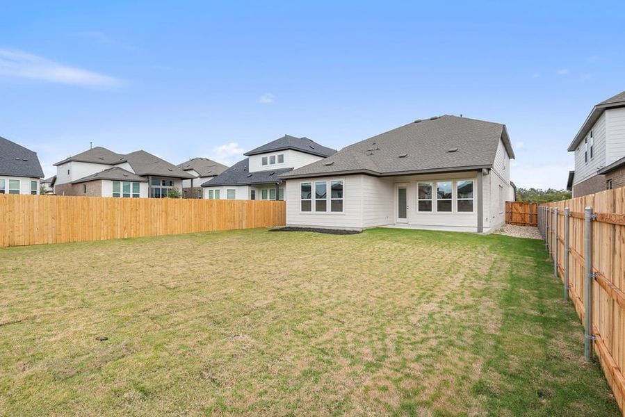 Exterior details and patio area of a home in Arbor Collection at Heritage, Dripping Springs (Image 26).