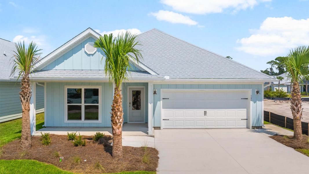 Front exterior of a new home in Windmark Beach, Port Saint Joe, FL, highlighting curb appeal (Image 1).