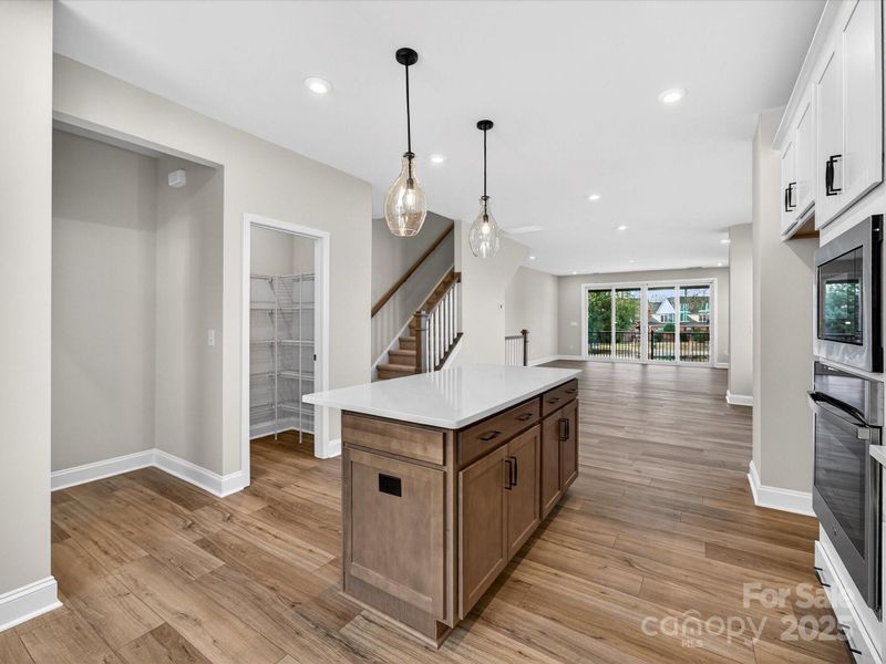 Walk-In Pantry and Island for Storage Convenience.