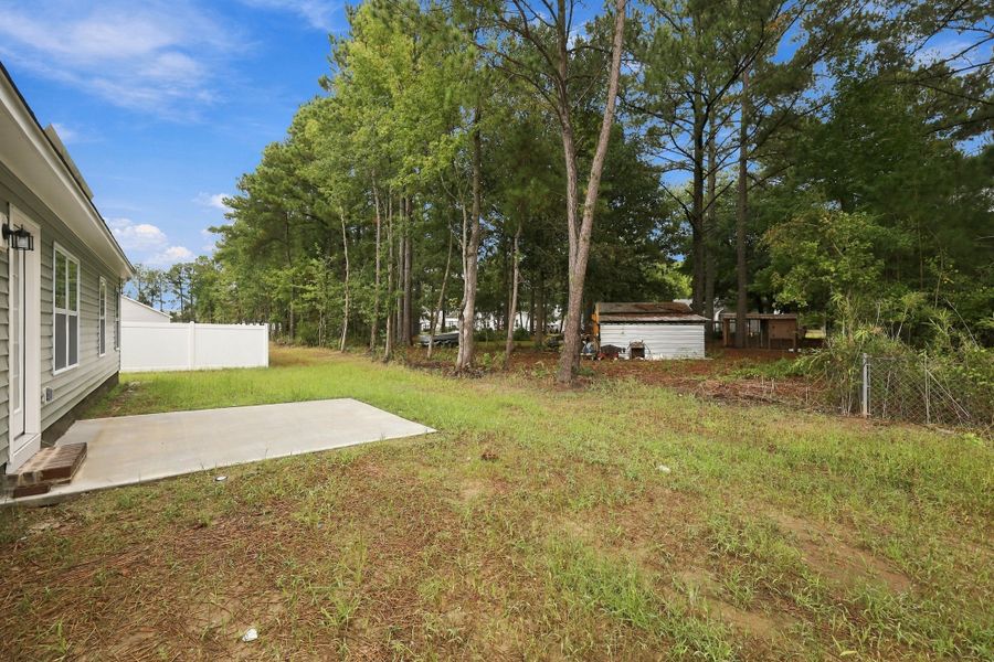 Exterior details and patio area of a home in Davenport Farms, Winterville (Image 22).