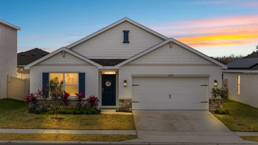 Front exterior of a new home in Farm at Varrea, Plant City, FL, highlighting curb appeal (Image 2). Front exterior of a new home in Farm at Varrea, Plant City, FL, highlighting curb appeal (Image 2).