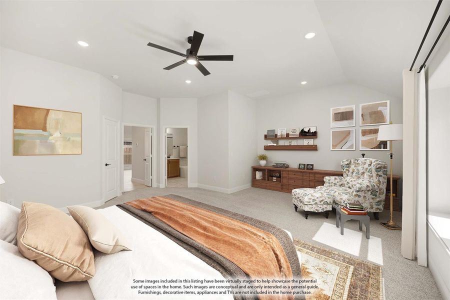 Spacious master bedroom with ceiling fan, carpet flooring, sitting area, and ensuite bathroom doorway