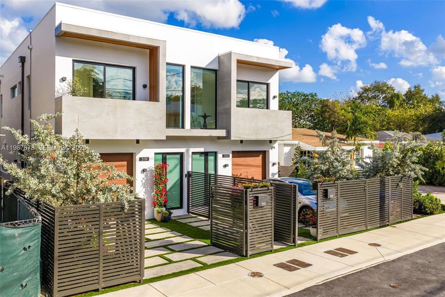 Front exterior of a new home in , Miami, FL, highlighting curb appeal (Image 34).