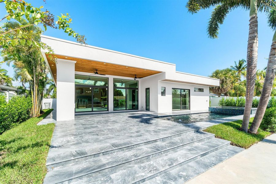 Front exterior of a new home in , Pompano Beach, FL, highlighting curb appeal (Image 23).