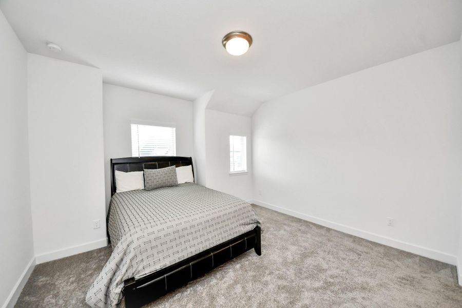 Inviting bedroom offering comfort and flexibility.
