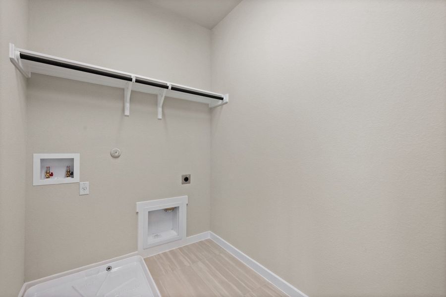 Spacious, unfurnished interior of a new home in Terrace Collection At Turner's Crossing, Buda (Image 42).